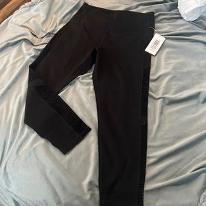 Black leggings. Mesh side stripe